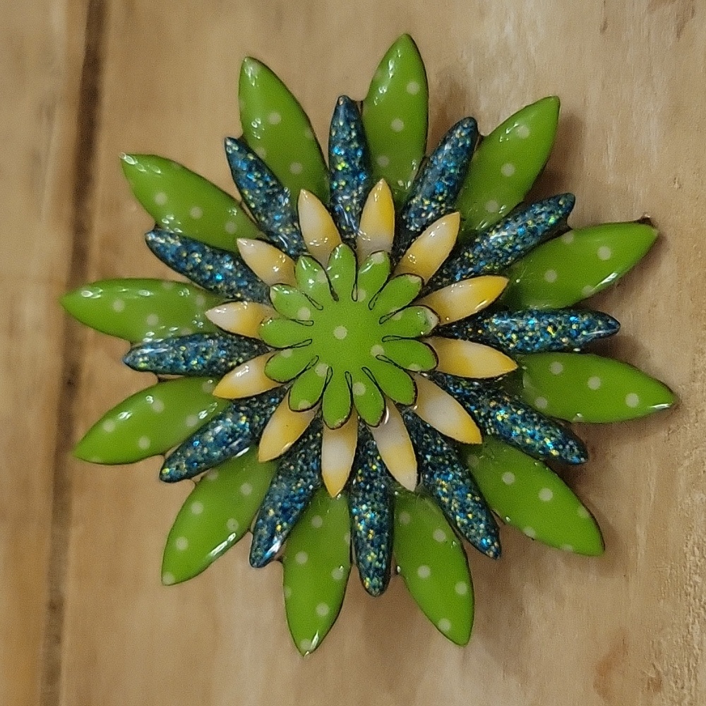 Pin/brooch made by Lucinda.com. Green, blue, yellow, white colors